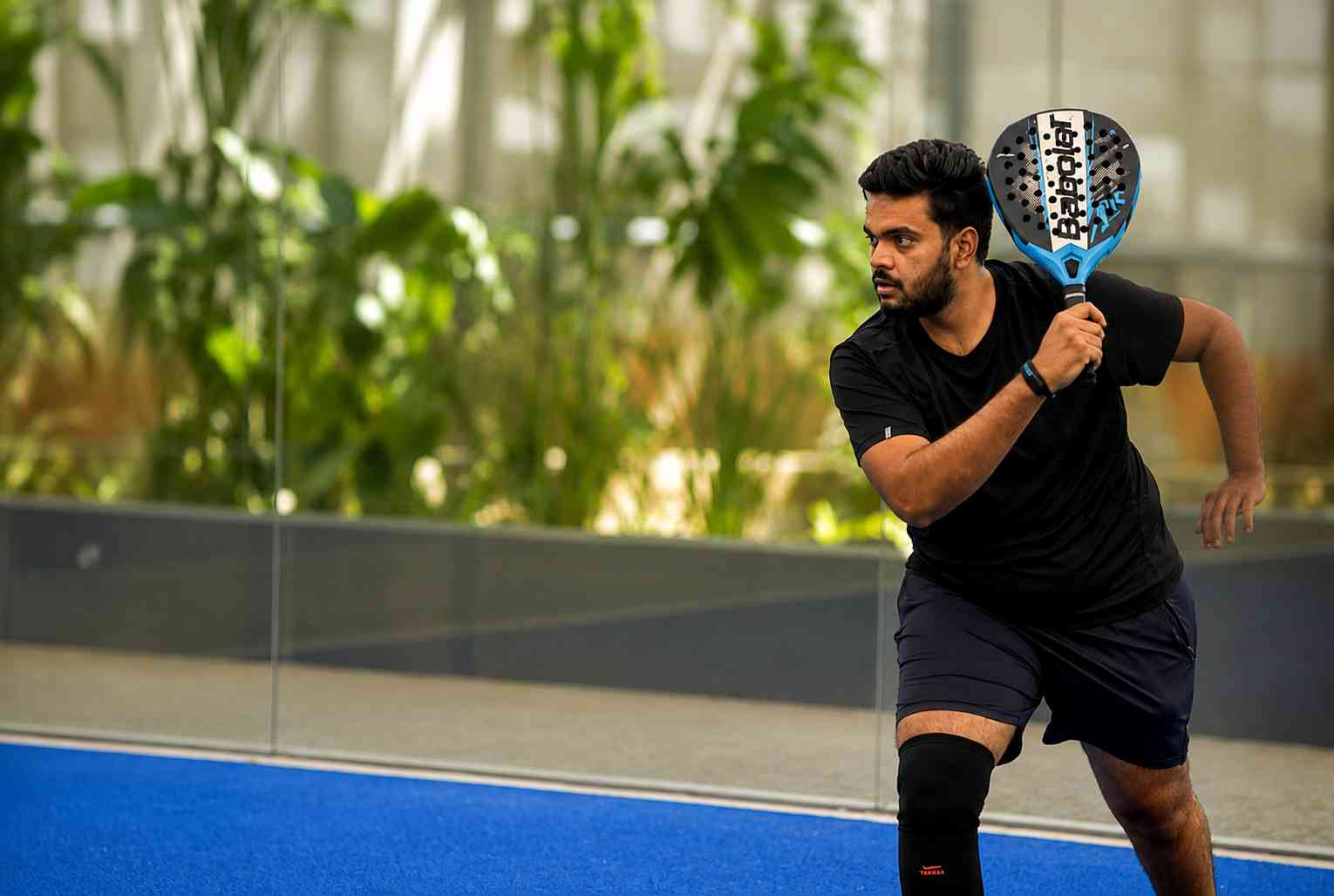 Padel players during an intense rally